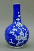A Chinese porcelain blue and white prunus vase. 24 cm high.