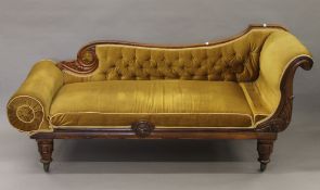 A Victorian rosewood chaise lounge. 180 cm long.