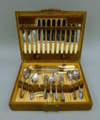 A canteen of silver-plated cutlery. 39 cm wide.