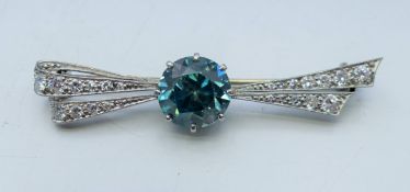 An Art Deco platinum diamond and zircon brooch. 4.75 cm long.