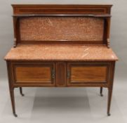 Two Edwardian marble-topped mahogany washstands. The larger 122 cm wide, the other 192 cm wide.