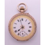 A 9 K gold fob watch. 3.5 cm diameter. 27.5 grammes total weight.