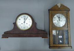 An early 20th century oak wall clock and a mahogany mantle clock. The latter 53 cm wide.