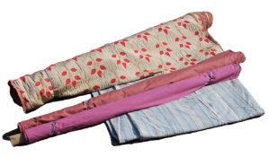 Three rolls of fabric/material: pink cotton,