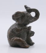 A small bronze elephant. 4.5 cm high.