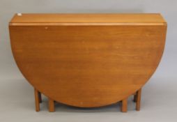 A 20th century folding table. 24.5 wide folded and 155 cm open x 107 cm wide.
