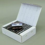 A box of twelve jeweller's loupes. 16 cm wide.