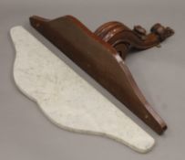 A Victorian marble-topped mahogany wall bracket. 82.5 cm wide.