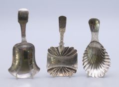 Three Georgian silver caddy spoons. Largest 8.5 cm high.