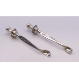 A pair of Victorian silver ear wax spoons. 6.5 cm high.