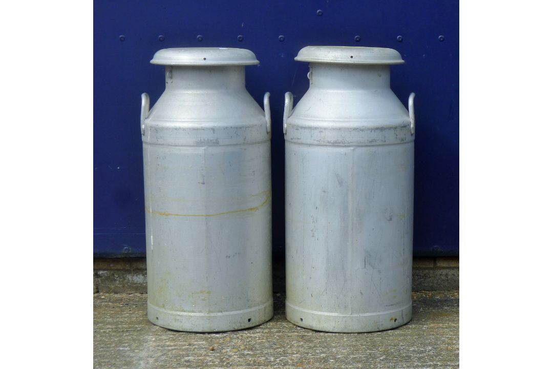 Two milk churns. Each 74 cm high.