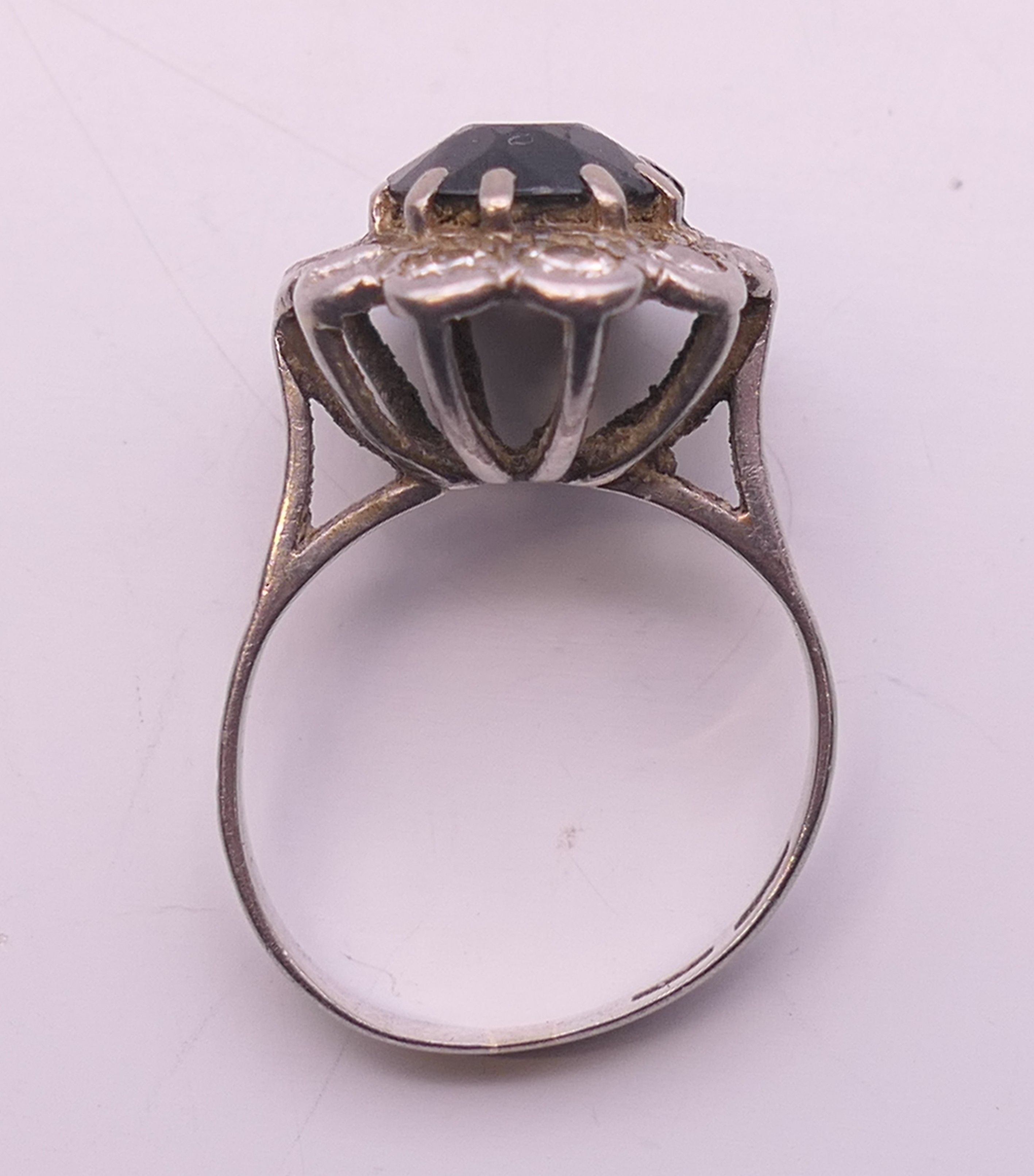 A platinum diamond and sapphire ring. Ring size H. - Image 4 of 8