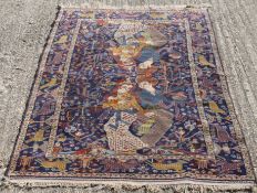 A Persian blue ground rug. 110 x 190 cm.