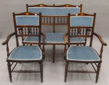 An Edwardian inlaid mahogany three-piece salon suite. The settee 114 cm wide.