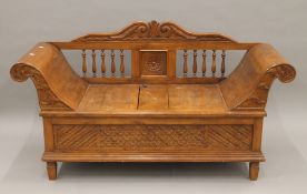 An Eastern hardwood box settle. 150 cm wide.