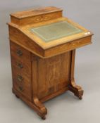 A Victorian inlaid rosewood Davenport. 53 cm wide.