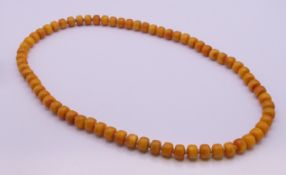 A string of beads. Approximately 70 cm long.