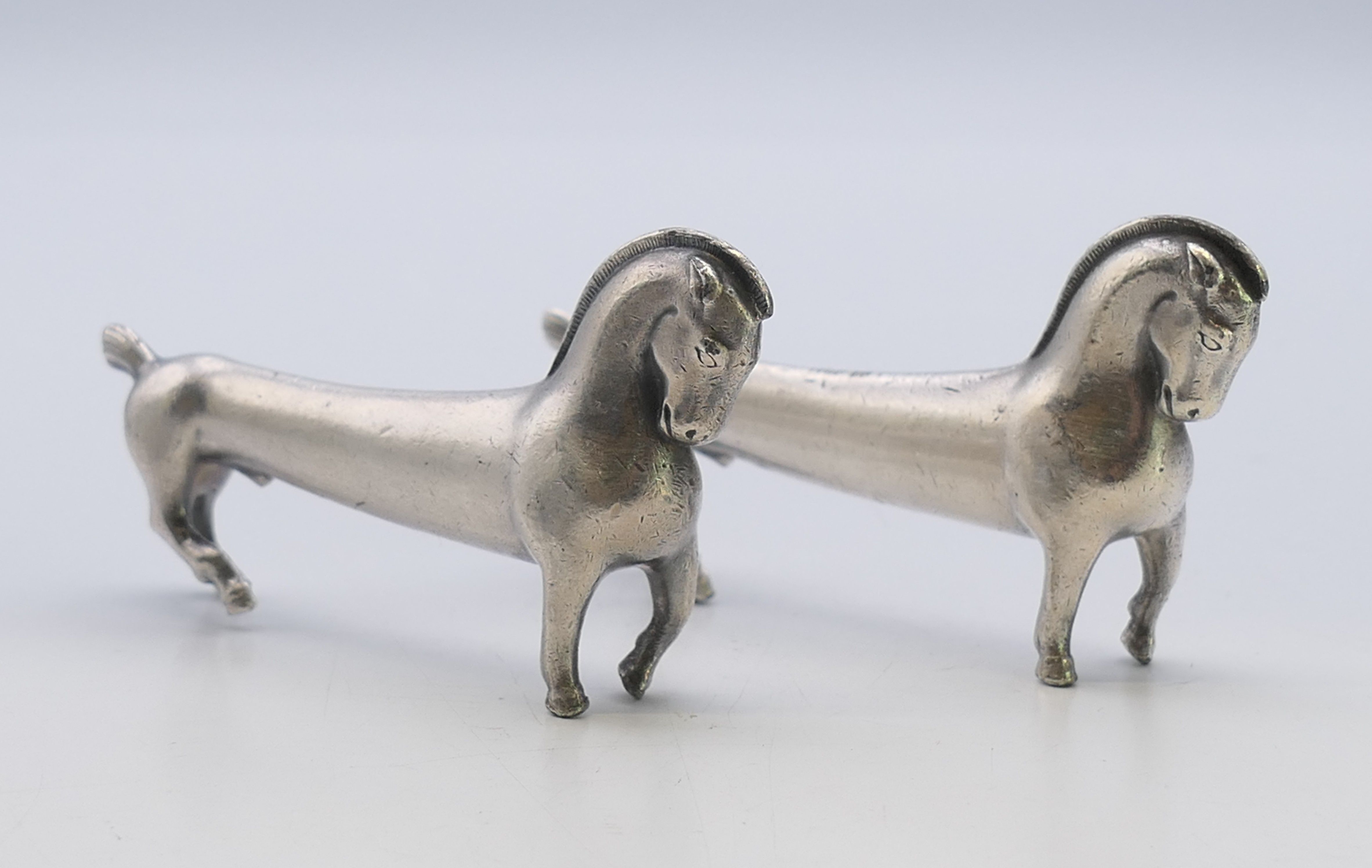 Two WMF horse form knife rests. 8.5 cm x 4.5 cm.
