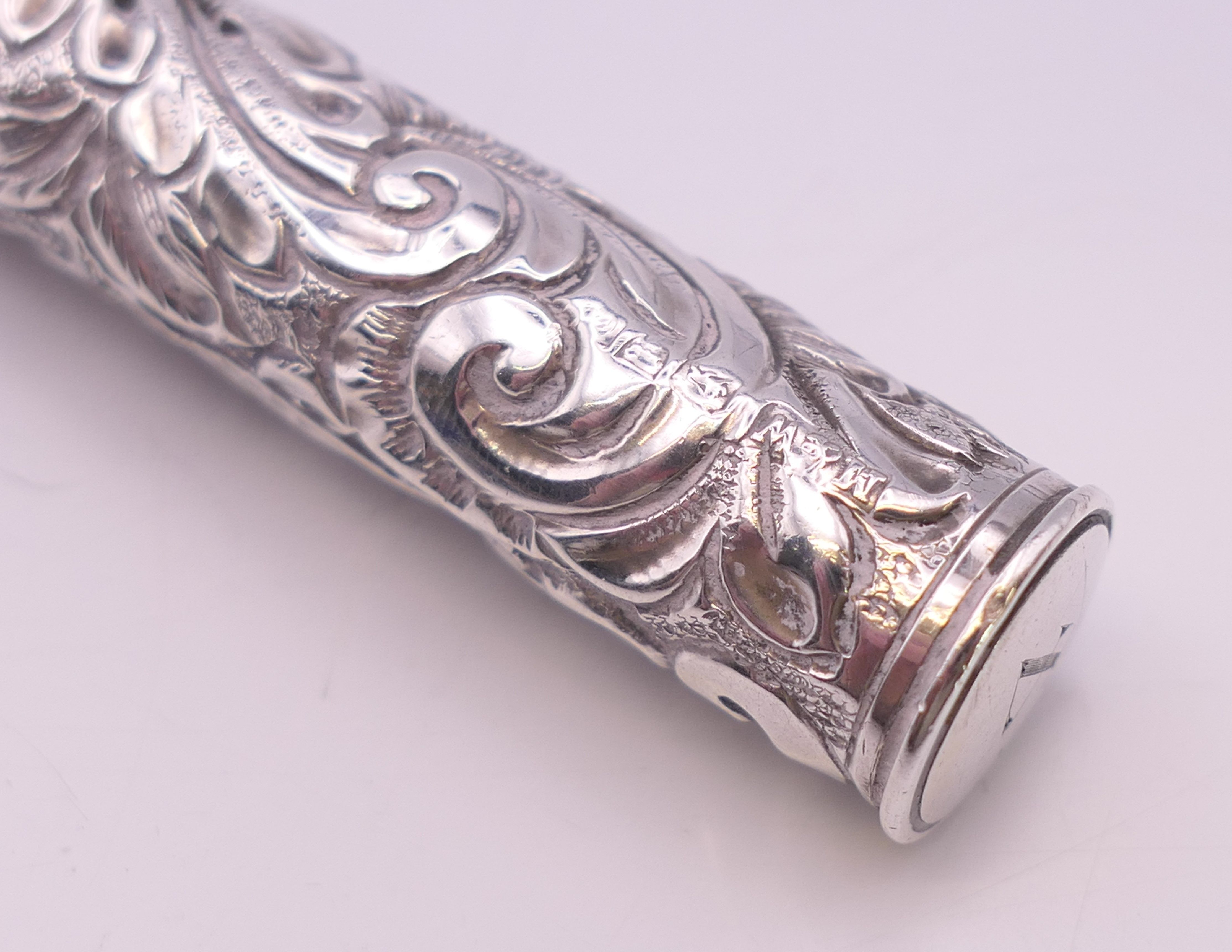 An embossed silver needle case. 14 cm high. - Image 3 of 5