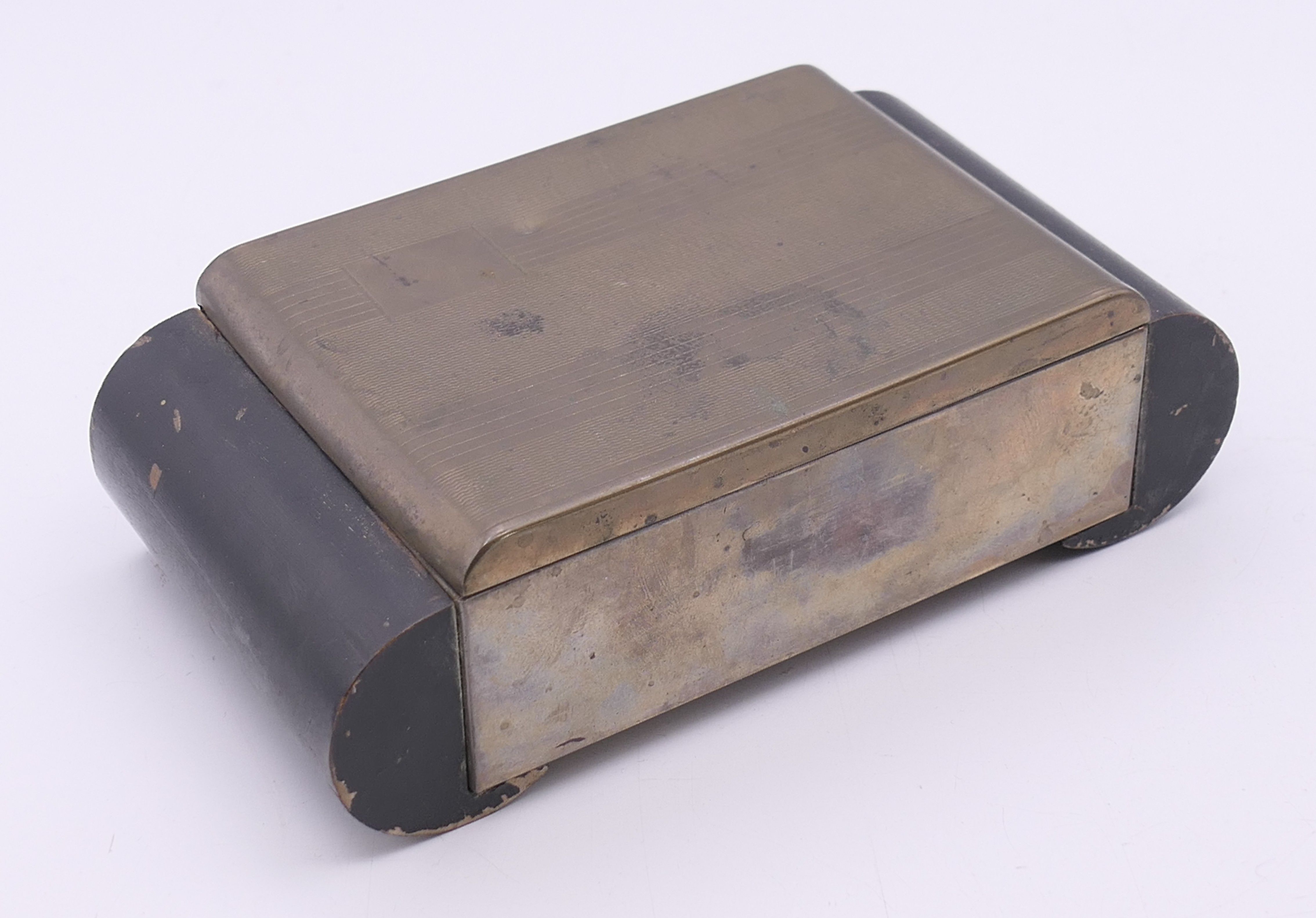 An Art Deco metal and wood cigarette box containing a quantity of coins. Box 15.5 x 8.25 x 4.5 cm. - Image 3 of 16