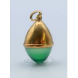 An 18 ct gold (tested) gold pendant. 1.5 cm high.
