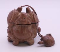 A turtle inro. 9 cm high.