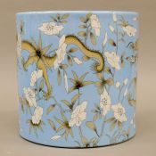 A Chinese blue ground porcelain brush pot decorated with dragons. 20 cm high.