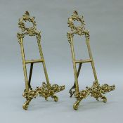 A pair of brass table easels. Each 41 cm high.