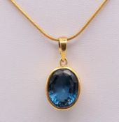 An 18 ct gold tourmaline pendant and chain. Pendant 1.