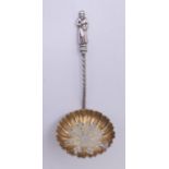 A Victorian silver gilt apostle sifter spoon. 9.5 cm high.