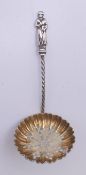 A Victorian silver gilt apostle sifter spoon. 9.5 cm high.