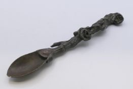 A Chinese bronze spoon. 19 cm long.