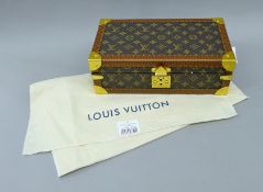 A Louis Vuitton-style watch box. 34 cm wide.
