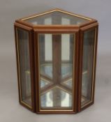 A small glazed display cabinet with two shelves. 62 cm high.