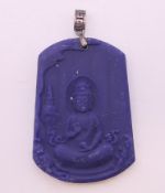A Chinese silver-topped seated Buddha pendant. 5 cm high.