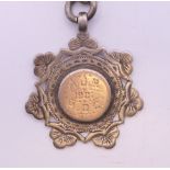A silver Albert pocket watch chain and fob, the fob engraved AJR 1901 HQC. 38 cm long, fob 3.