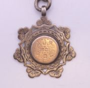 A silver Albert pocket watch chain and fob, the fob engraved AJR 1901 HQC. 38 cm long, fob 3.