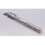 An embossed silver needle case. 14 cm high.
