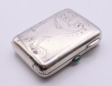 A Russian silver cigarette case, with engraving and jade release button. 7 x 5 cm.