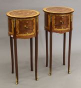 A pair of inlaid circular bedside cabinets. 32 cm diameter.