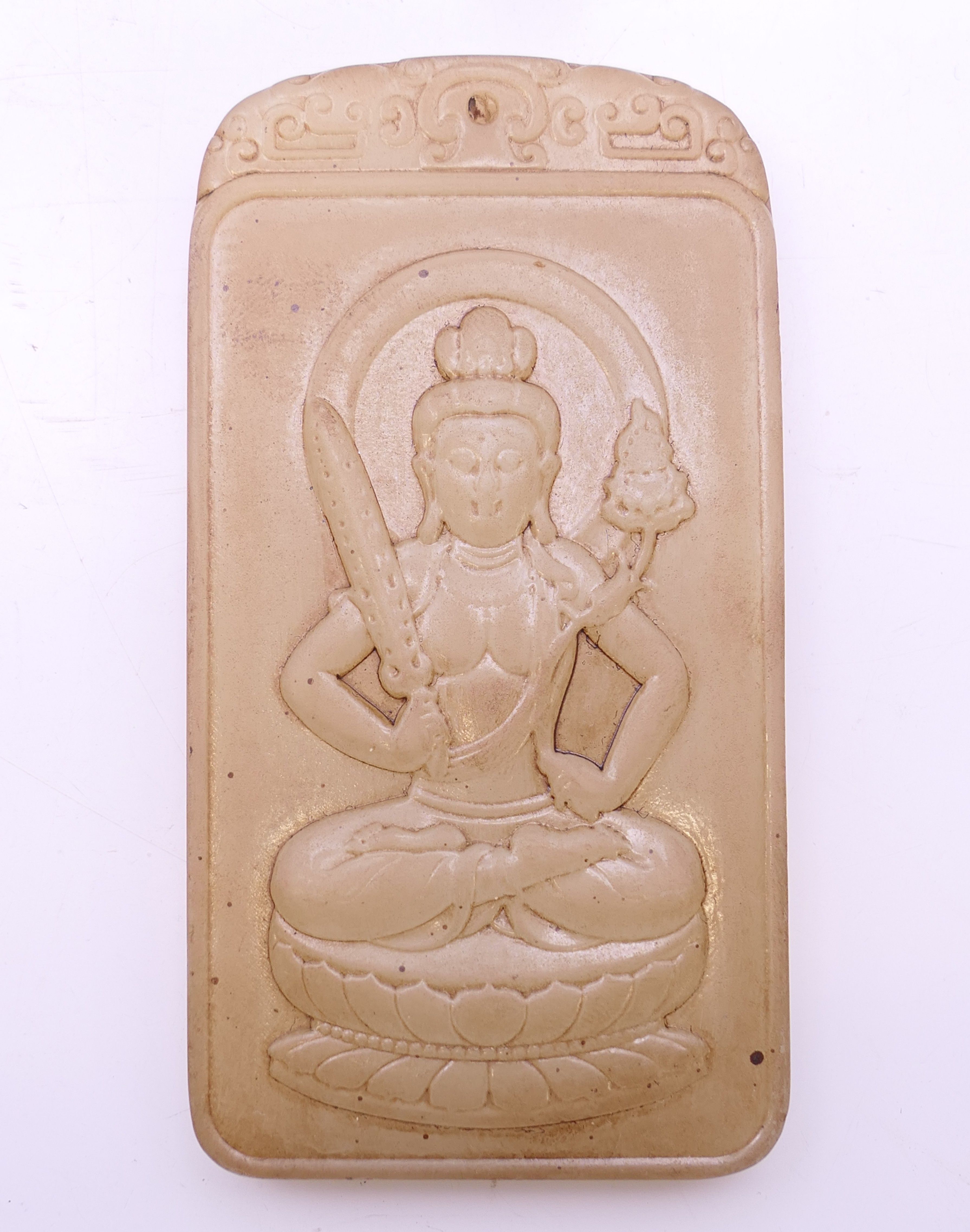 A jade seated Buddha plaque. 10 cm x 5.25 cm.