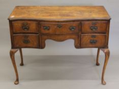 An early 20th century walnut desk. 106 cm wide.