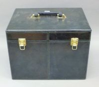 A dark navy blue leather vanity case. 35.5 cm wide.