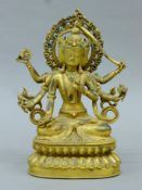 A gilt bronze multi-armed deity. 24.5 cm high.
