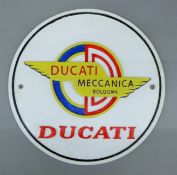 A cast iron 'Ducati' sign. 24.5 cm diameter.