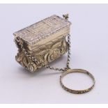 A Victorian silver gilt castle top basket form vinaigrette. 2.25 cm high.