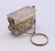 A Victorian silver gilt castle top basket form vinaigrette. 2.25 cm high.