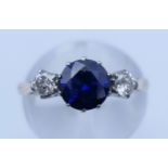 An 18 ct gold sapphire and diamond ring. Ring size L/M.