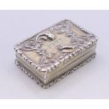 A Georgian silver gilt vinaigrette. 3.5 cm x 2.5 cm.