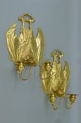 A pair of gilt bronze wall sconces in the form of bats. 35 cm high.